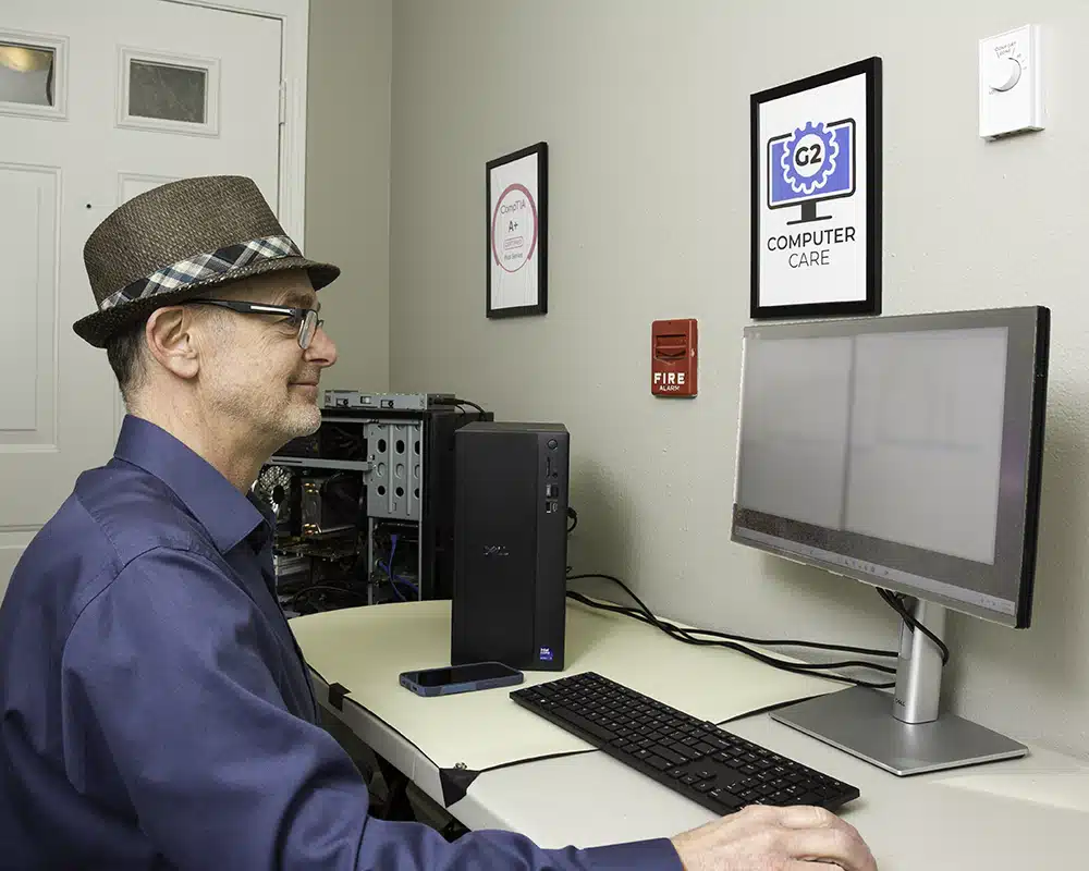 Computer repair technician working on a desktop computer