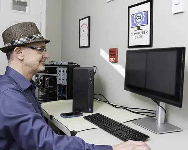 Gary with G2 Computer Care working on a computer